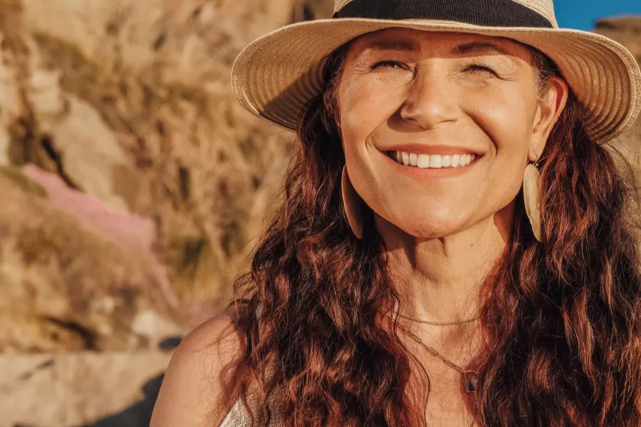 Smiling mature woman in a sun hat