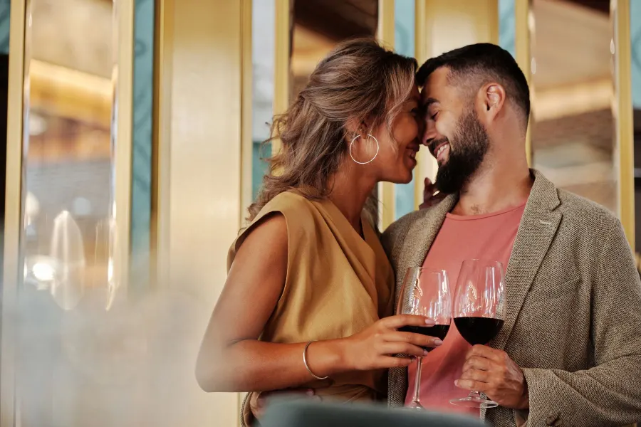 Couple in a relationship sharing a moment over wine
